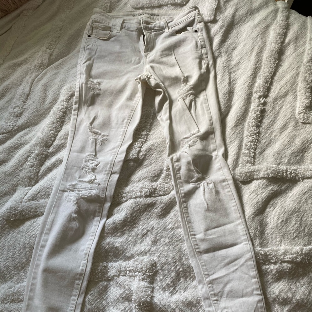 Distressed white jeans